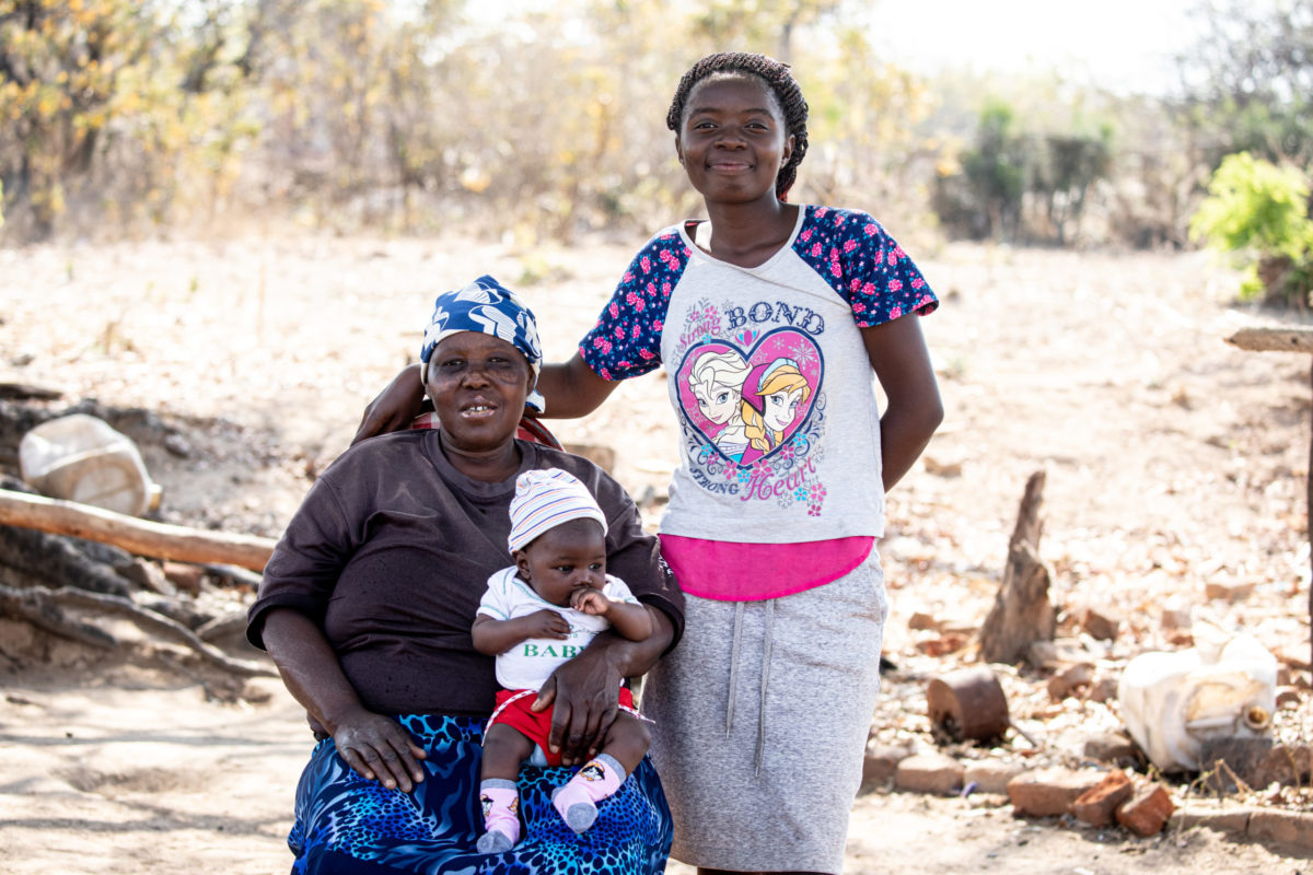 SEPTEMBER 14, 2021: MOREBLESSING TAMAYI (16) poses for a pictures with her mother-in-law and son. © Charmaine Chitate/ CARE.