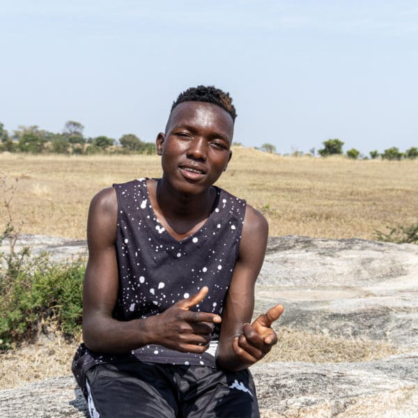 June 01, 2021: Desmond Jeke (20), from Mahora/Tizirai 1 Village in Zaka district, takes on a pose popularised by Zimbabwe dancehall artists who are the primary inspiration for young people in Zimbabwe. © Charmaine Chitate/ CARE