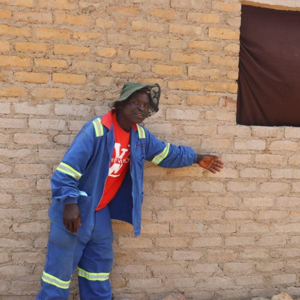 APRIL, 6, 2022: OSMOND CHARUMBIRA (53), Philomina’s husband, showcasing a section of the house his wife developed using proceeds from the VSLA. ©Emmanuel Mazangwa/ CARE