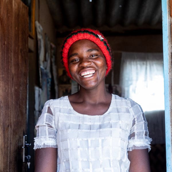 SEPTEMBER 13, 2021: When EVERJOY MASASE (19) left Rufaro Village in Masvingo, she didn’t think she’d have something to smile about. Nine months later, with her new skills, she earns a few dollars from selling the face masks she sews. © Charmaine Chitate/ CARE.