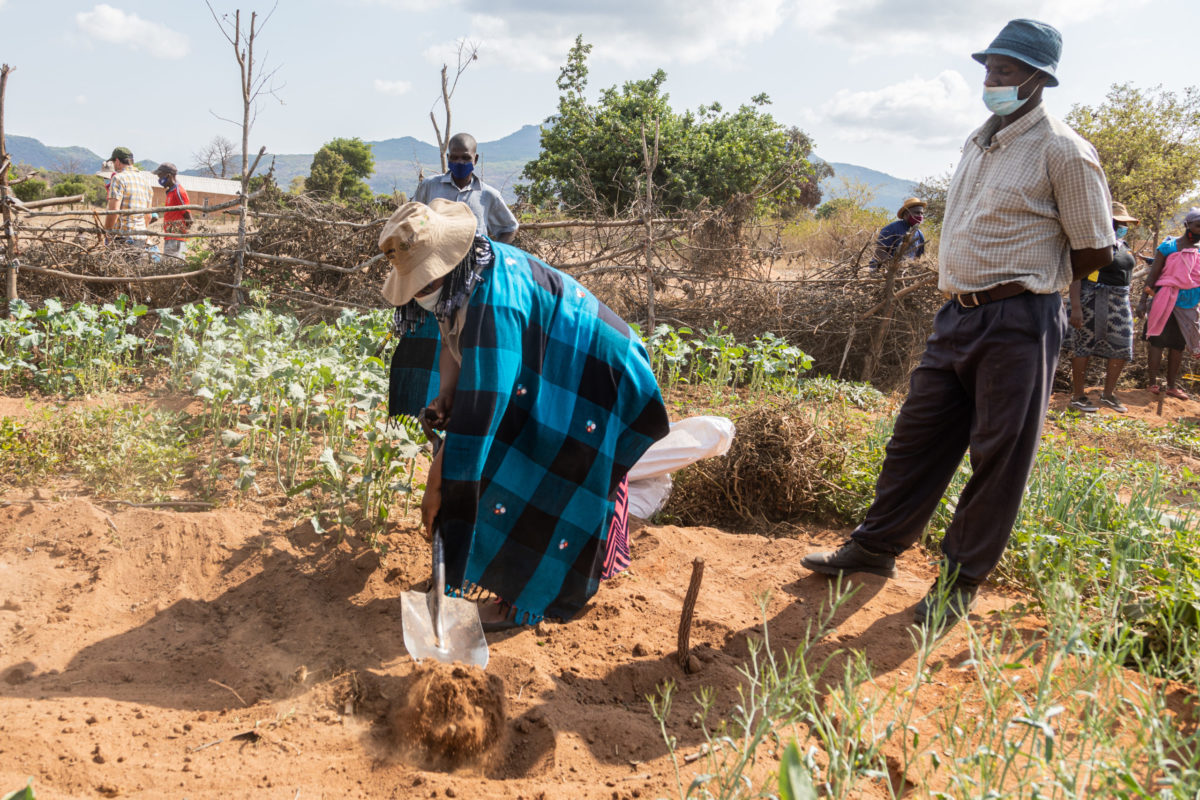 OCTOBER 07, 2021: PATISIWE ZABA, Resilience Lead at Amalima Loko, shovels soil off a garden bed. © Charmaine Chitate/ CARE